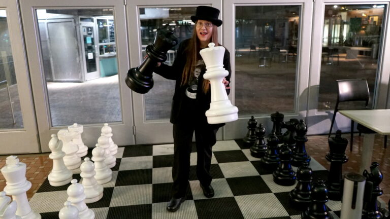 Quirky Author Lori R. Lopez Plays Chess at 54th San Diego Local Authors Exhibit