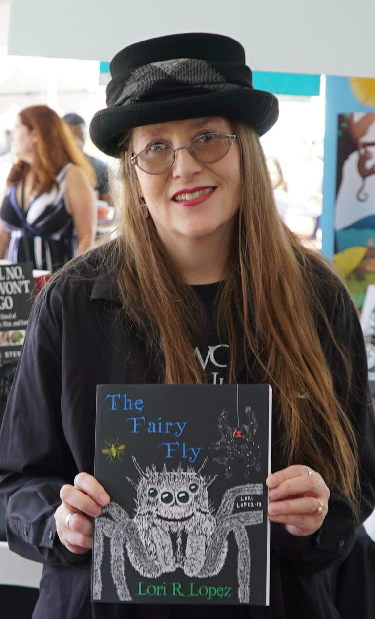 San Diego Festival Of Books August 2018 - Author Lori R. Lopez holding fantasy novel The Fairy Fly